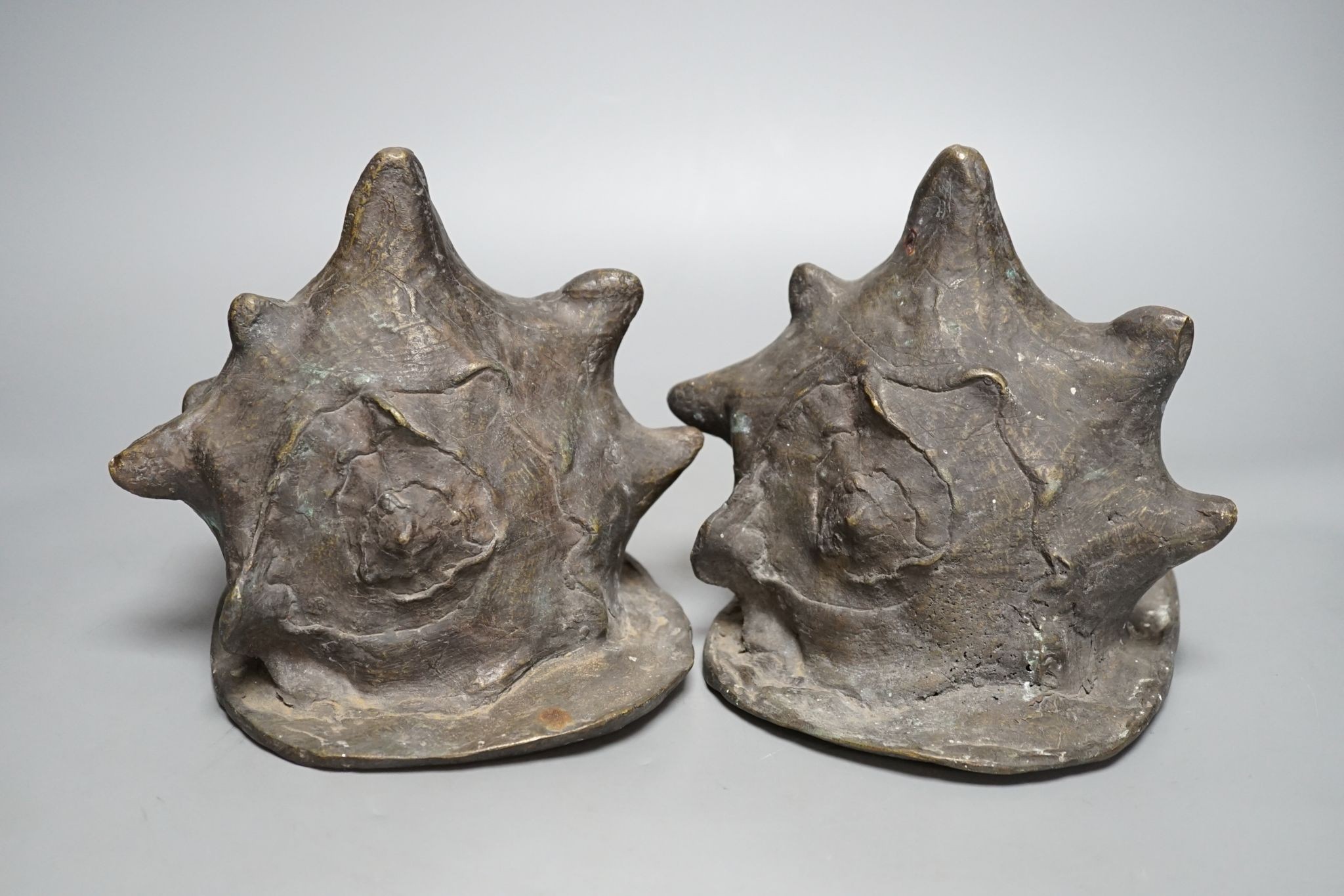 A pair of spelter conch shells, 24cm